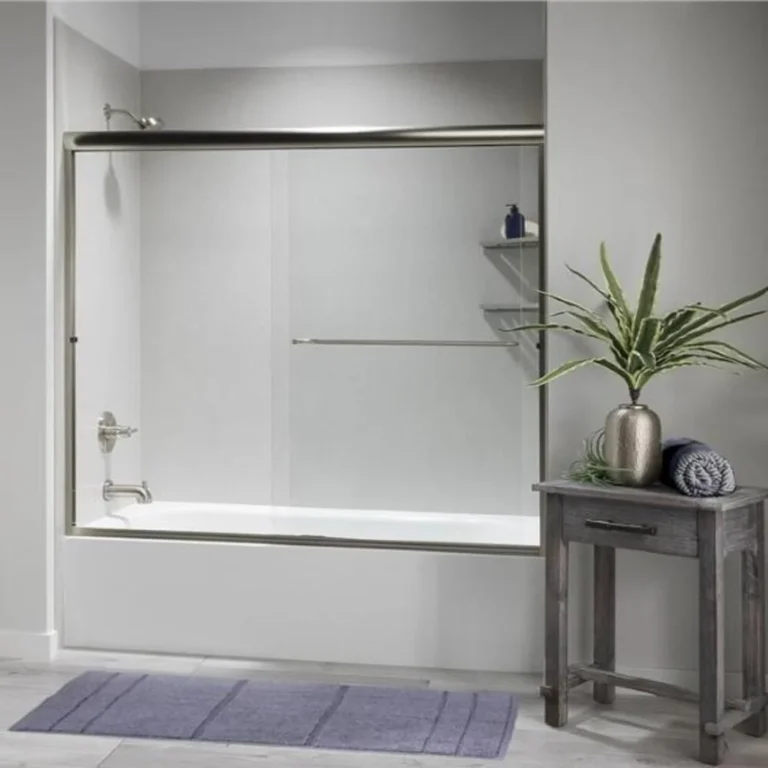 White bathtub and shower enclosure with sliding glass doors