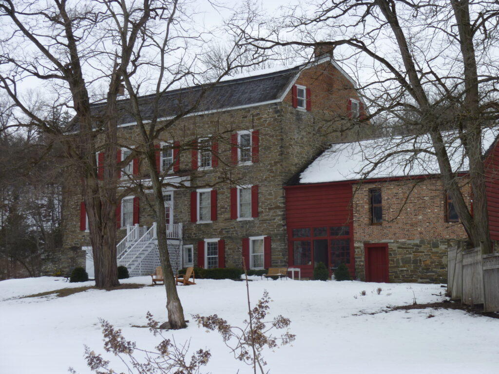 Ariaantje Coeymans House, a stone historic house with red shutters in Coeymans, New York
