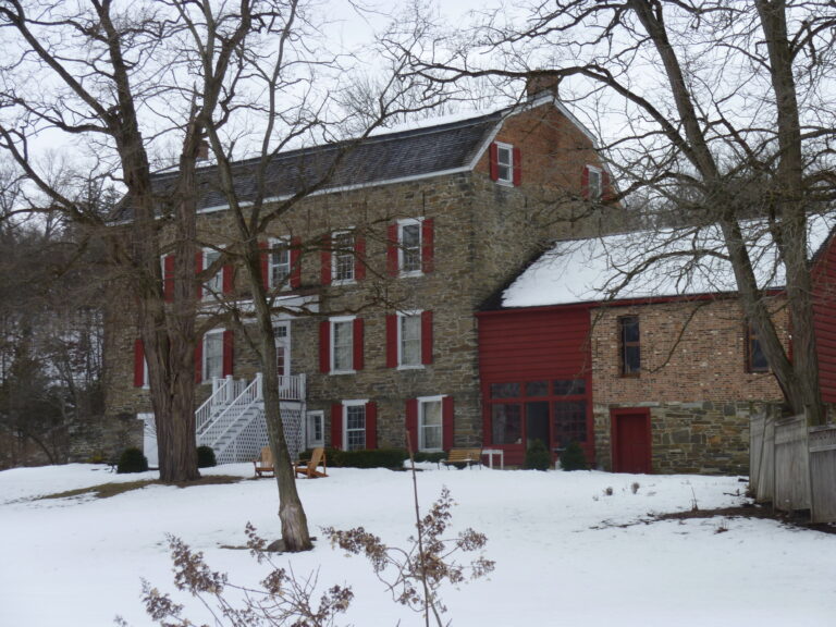 Ariaantje Coeymans House, a stone historic house with red shutters in Coeymans, New York