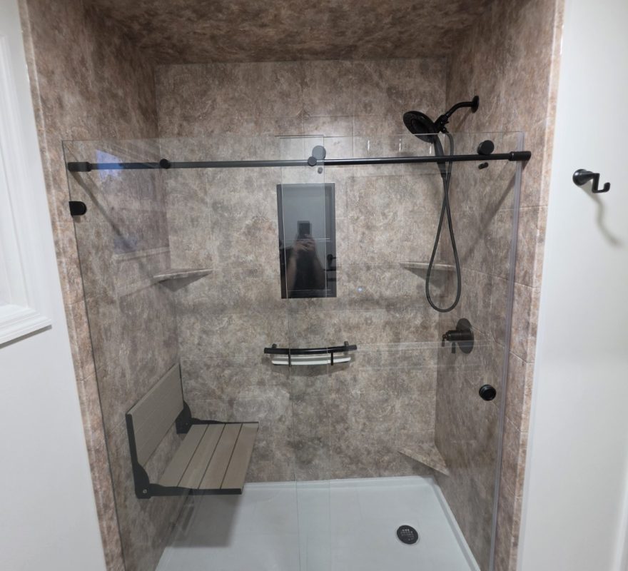 Real Moore Done Right low-threshold Selkirk shower with fold-down seat, handheld shower and black INVISIA shelf grab bar
