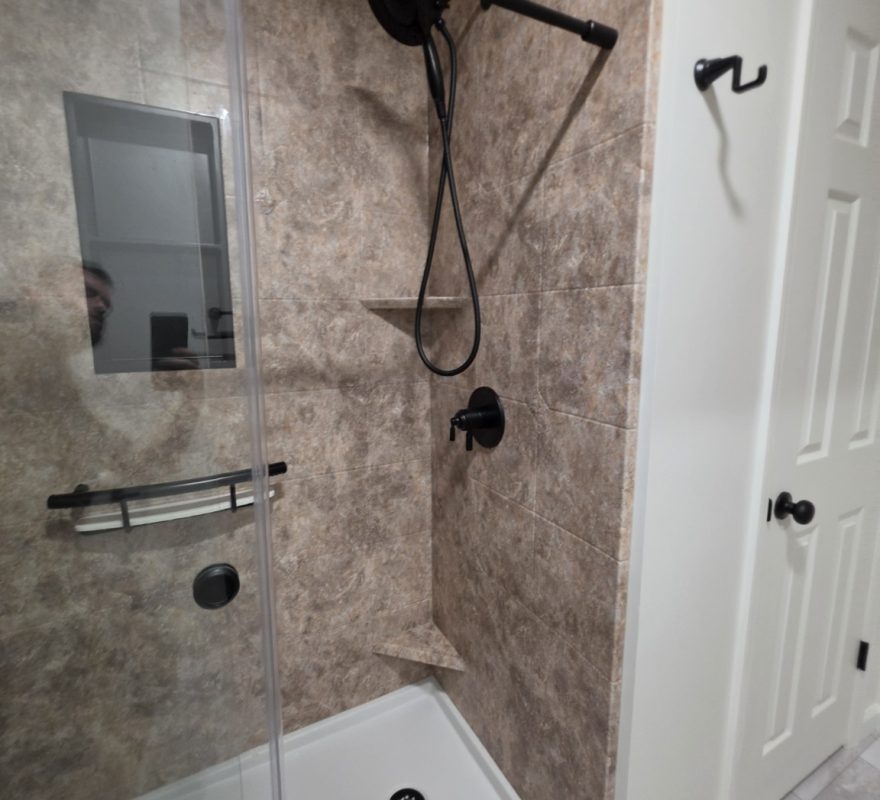 Real Moore Done Right Selkirk shower with handheld shower controls, low-threshold base and corner storage